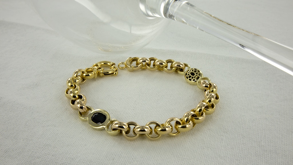 Asarmband dames geelgouden jasseron armband met zwarte stenen